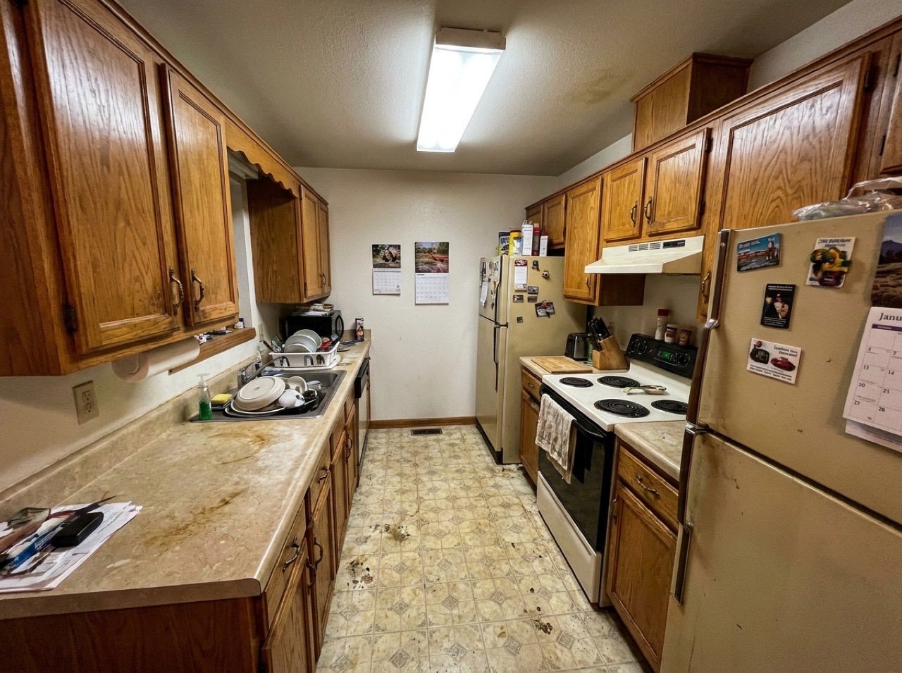 Dated closed-in kitchen before view